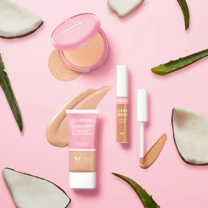 COVERGIRL Clean Fresh foundation, concealer and pressed powder on a pink background with coconut and aloe leaves